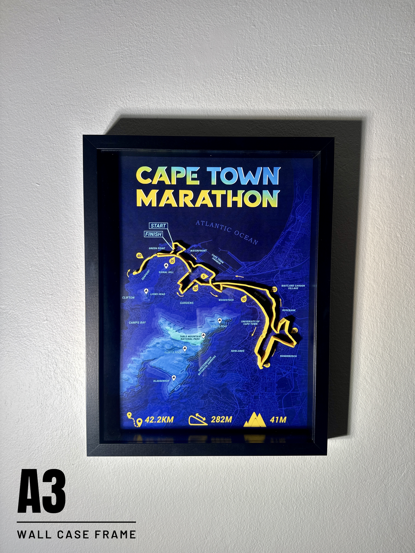 Framed map of the Cape Town Marathon on a white wall